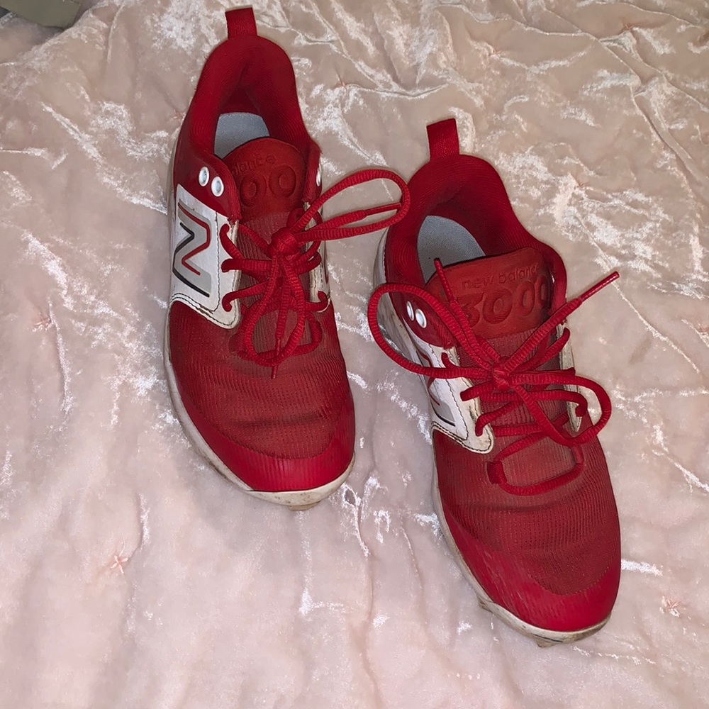 Red New Balance baseball cleats